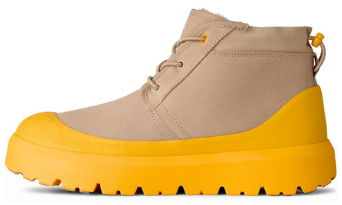Tan chukka boot with bright yellow sole.