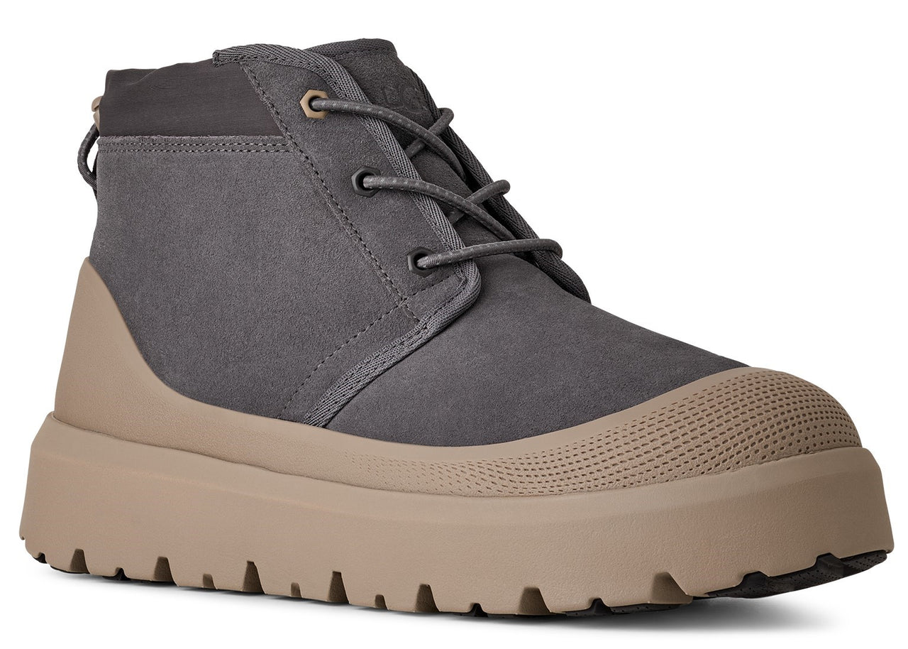 A gray suede chukka boot with a light-brown platform sole and lace-up closure.