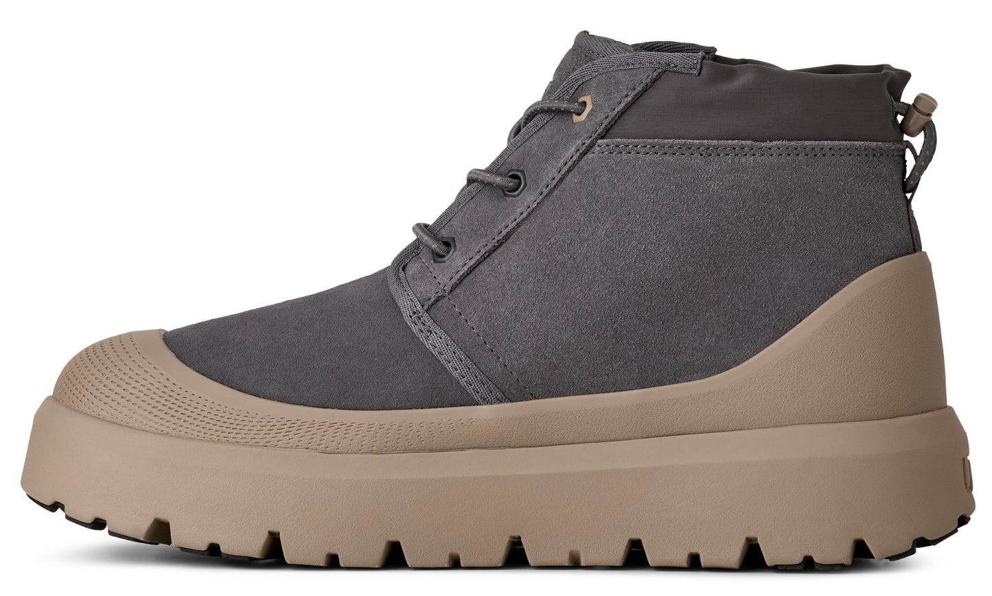 A gray chukka boot with a tan, lugged rubber sole.