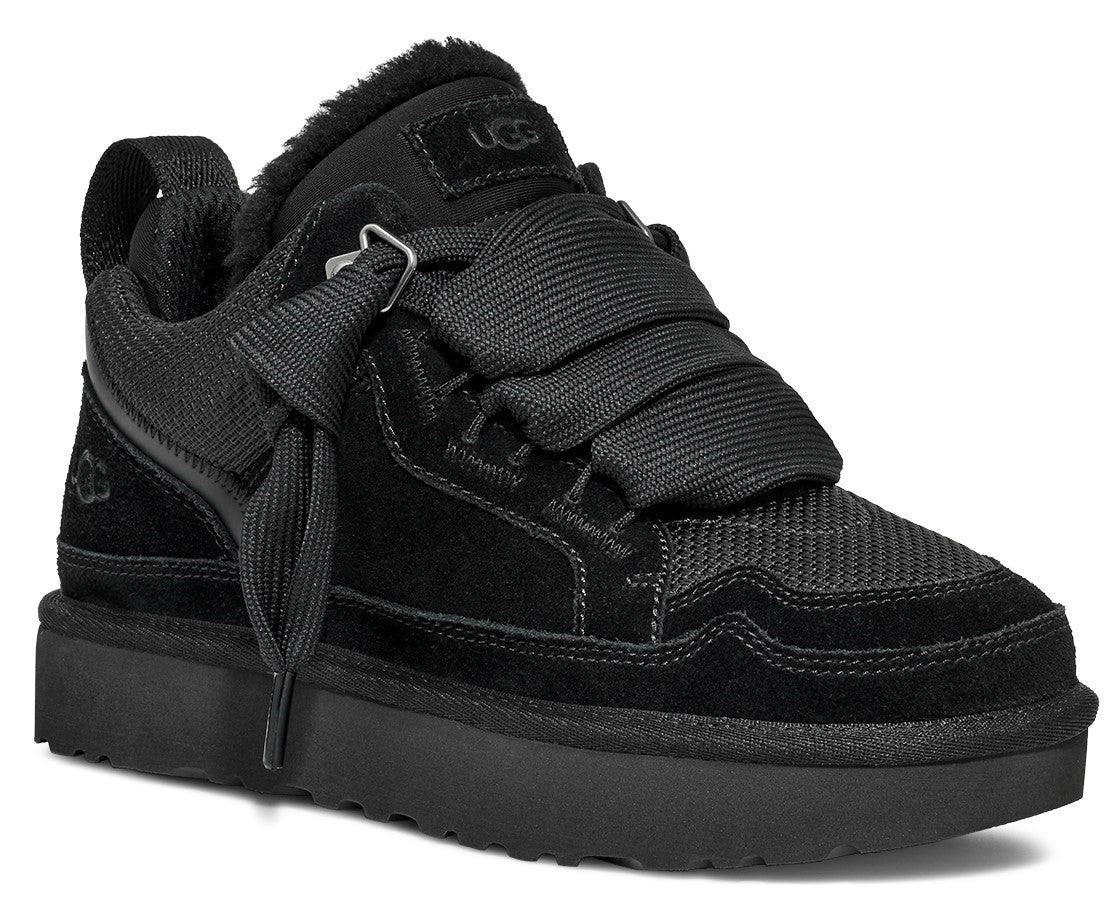 Black low top sneaker with a wide ribbon style laces and UGG tag.