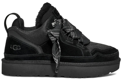 Black UGG shoe featuring a platform sole, black laces with a black and gray pattern, and a suede heel with UGG logo.