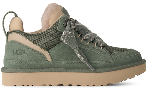 A side view of a low-top olive green suede and mesh sneaker with a thick beige platform sole, a plush tan interior collar, and patterned olive laces.