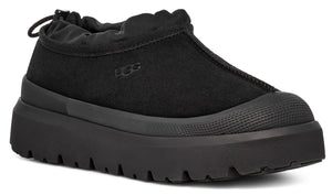 Black slip-on platform sneaker with a rounded toe.