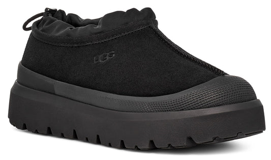 Black slip-on platform sneaker with a rounded toe.
