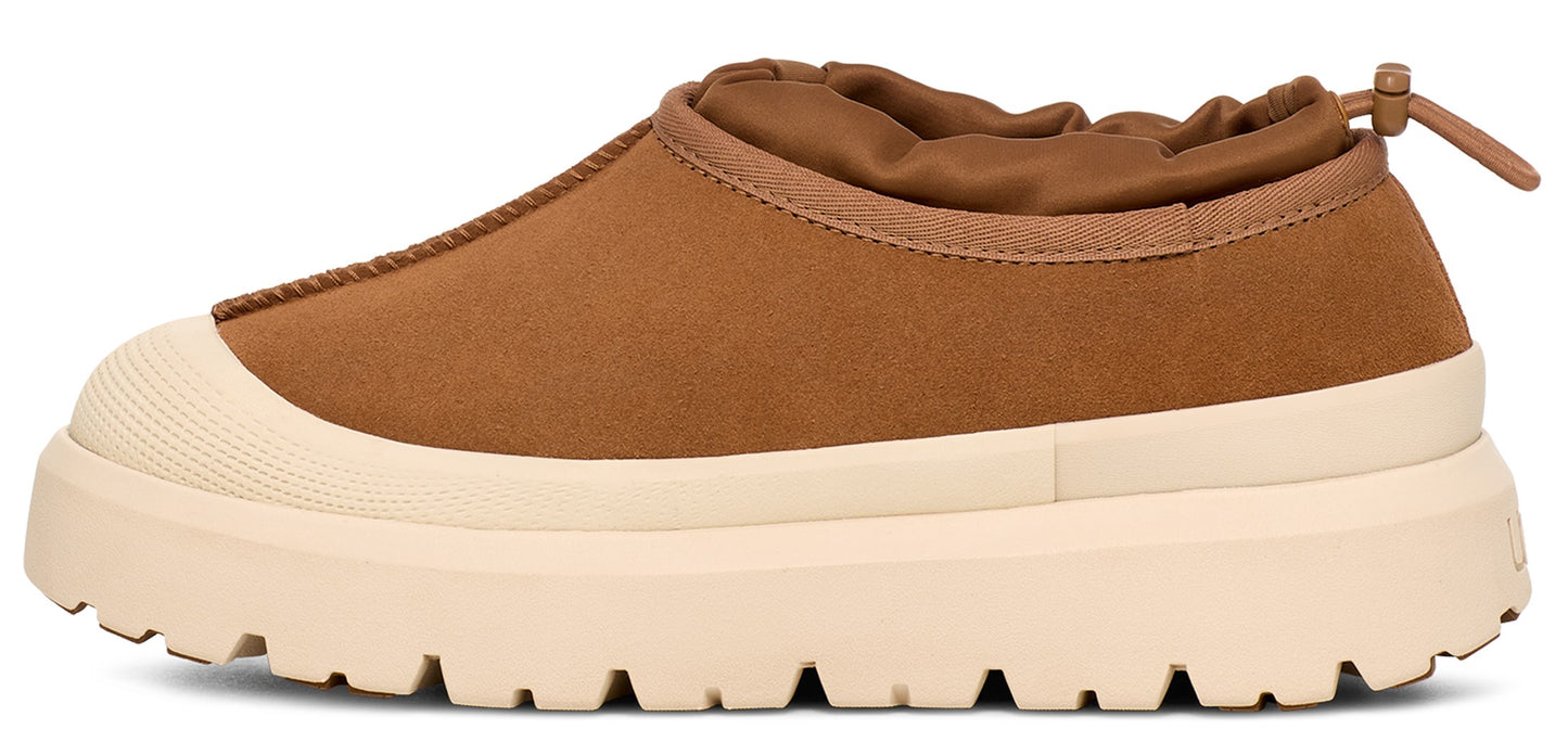 A brown, low-cut shoe with a beige rubber sole and toe cap.