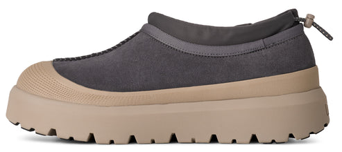 Gray slip-on shoe with tan sole and round toe.