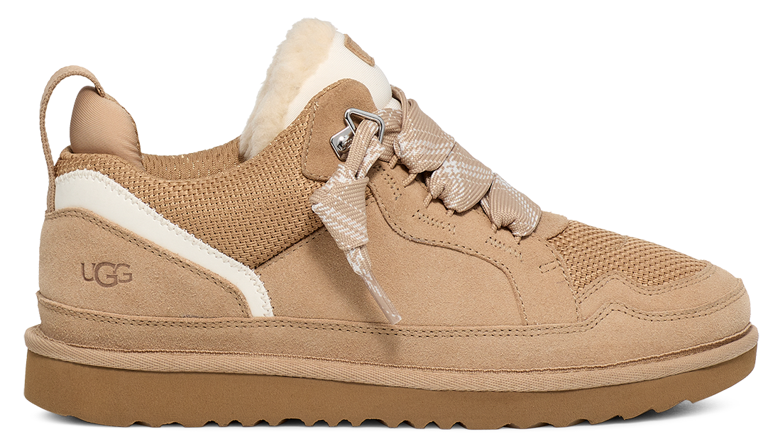 Tan low top sneaker featuring suede, white accent stripe, and shearling collar.
