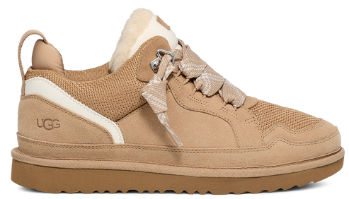 Tan low top sneaker featuring suede, white accent stripe, and shearling collar.