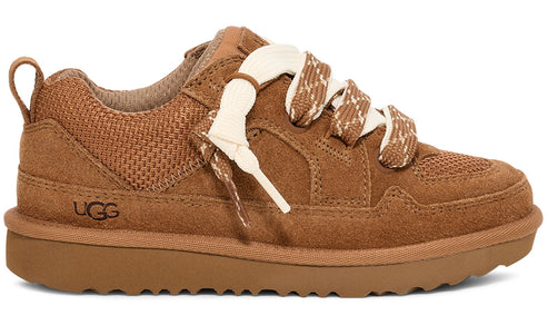 Suede sneaker, tan with thick, off-white patterned laces, mesh panels, and visible UGG logo.