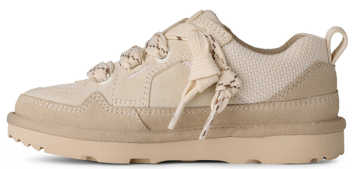 A low-profile, off-white sneaker with textured suede and a rope-patterned lace.