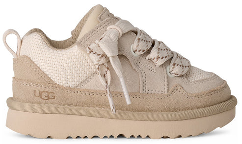 Beige low top sneaker with thick sole, suede accents, and rope laces.  The letters 'UGG' are on the side.