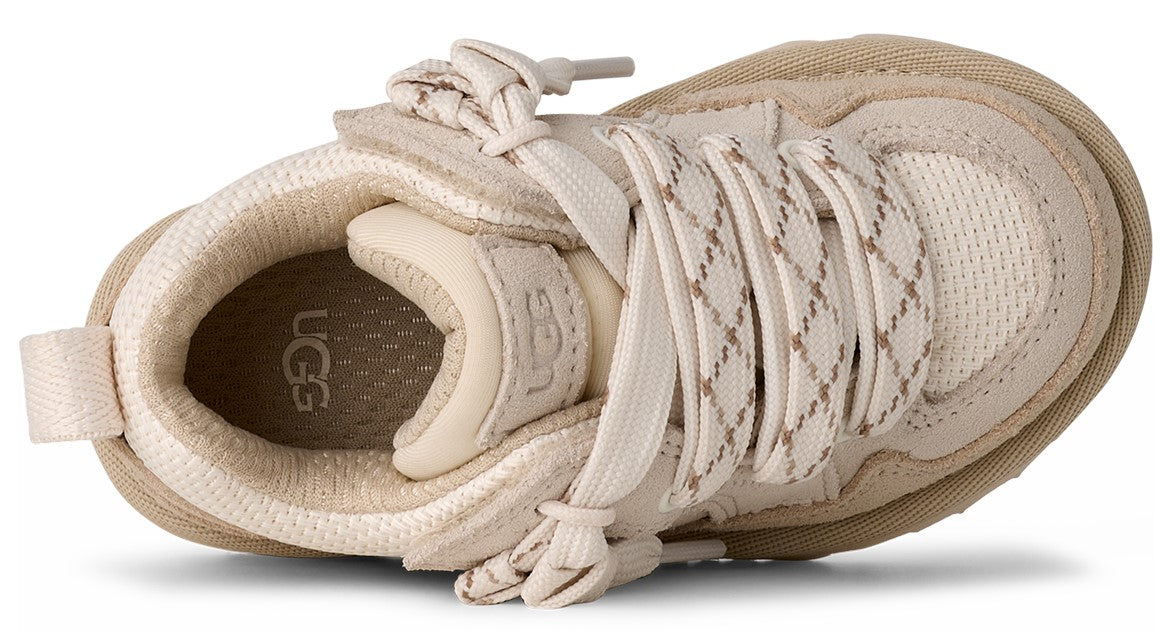 Tan athletic shoe with mesh and suede, featuring elastic laces and a small pull-tab.