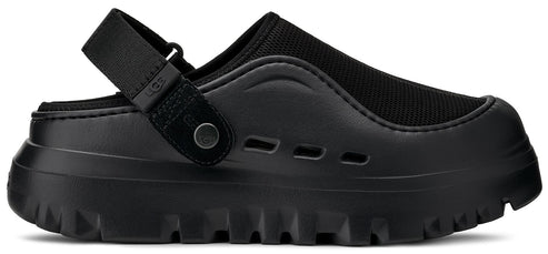 Black slip-on shoe with an adjustable strap and a thick, lugged sole.