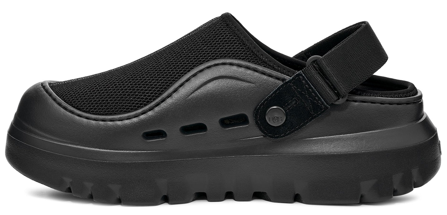 Black clog with adjustable heel strap and thick lug sole.