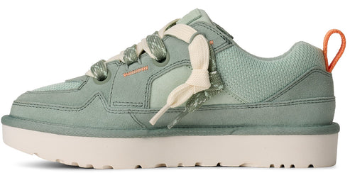 A light green sneaker with thick light beige laces and a beige sole.