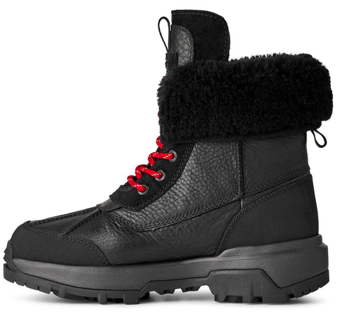 Black leather boot with red laces and black faux fur trim.