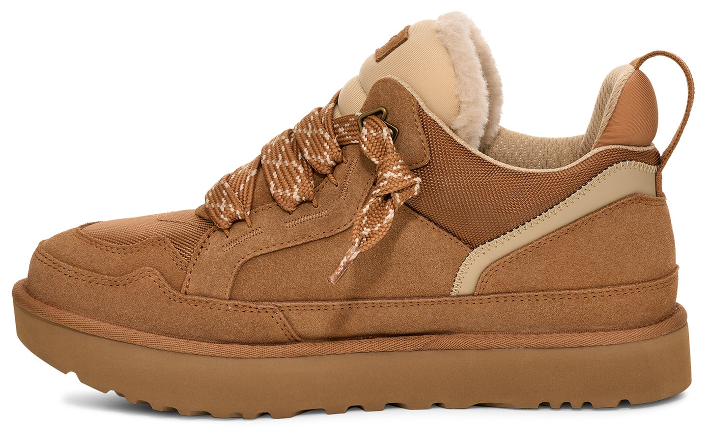 Low-top tan suede sneaker with thick, textured laces and lug sole.