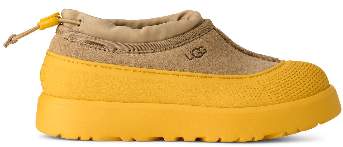 Yellow and tan UGG boot with toggle.