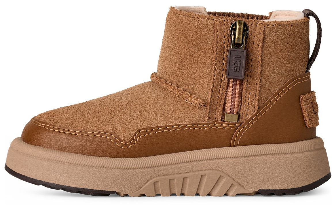 A child's ankle-high, tan suede boot with zipper.