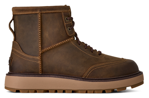 A brown leather lace-up ankle boot with a platform sole.