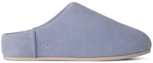 A light blue suede mule slipper with a minimalist design and a tan sole, featuring the UGG logo embossed on the side.