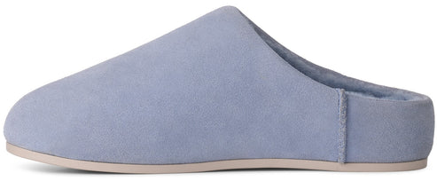 A light blue suede mule-style slipper with a flat, light beige sole and a soft, plush-lined interior.