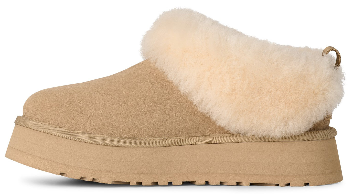 Beige platform clog slipper with light beige fur trim.