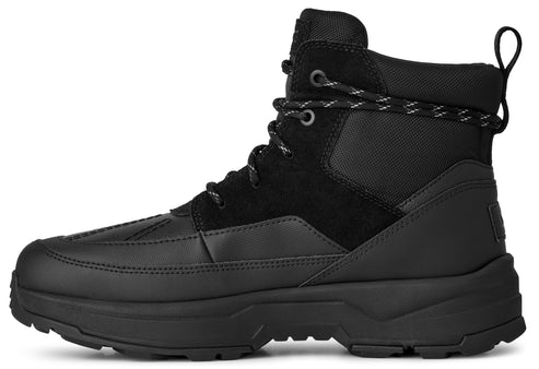 A black UGG Butte boot with lace-up closure and textured outsole.