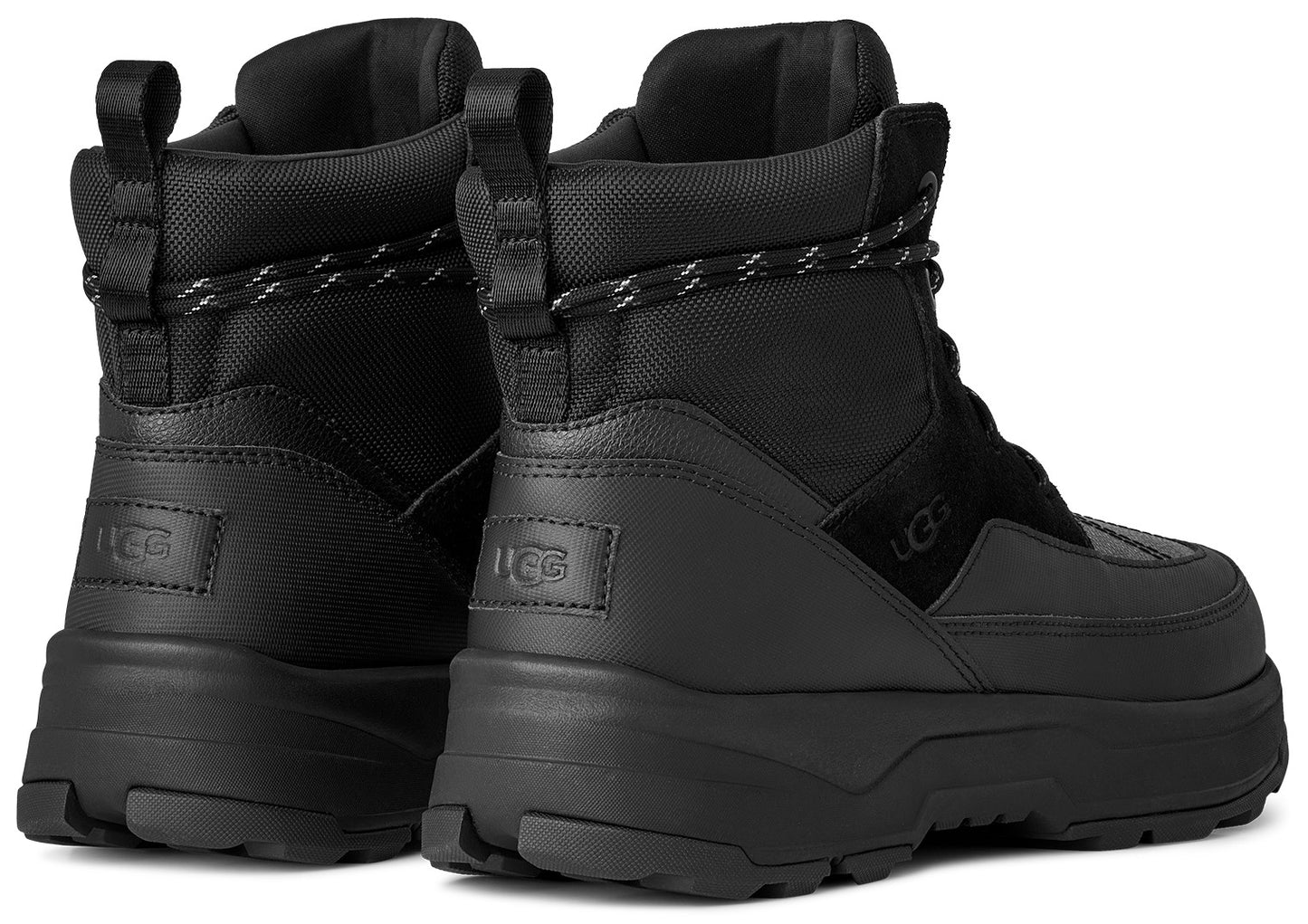 Two black high-top platform boots with pull loops and thick laces, visible logo on the side.