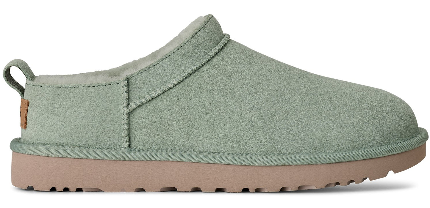 A light green slip-on shoe with a light brown sole.