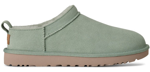 A light green slip-on shoe with a light brown sole.