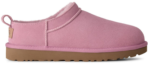 A light pink suede slipper with a brown rubber sole and a small branded tab on the heel.