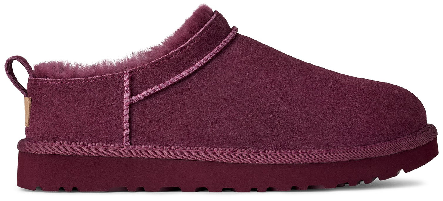 Maroon slip-on shoe with fur lining and loop pull.