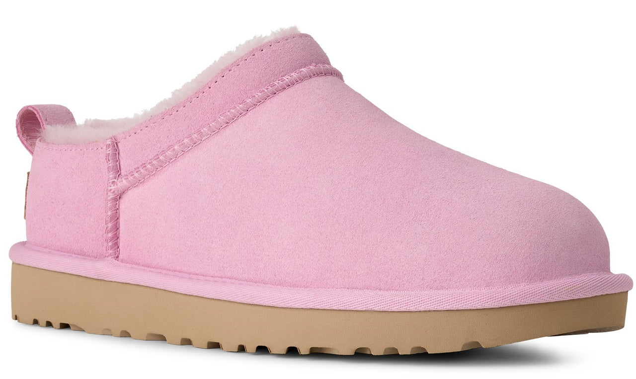 A pink, closed-toe slipper with a tan sole.