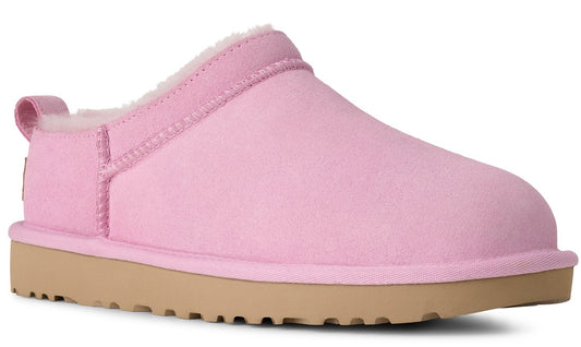 A pink, closed-toe slipper with a tan sole.