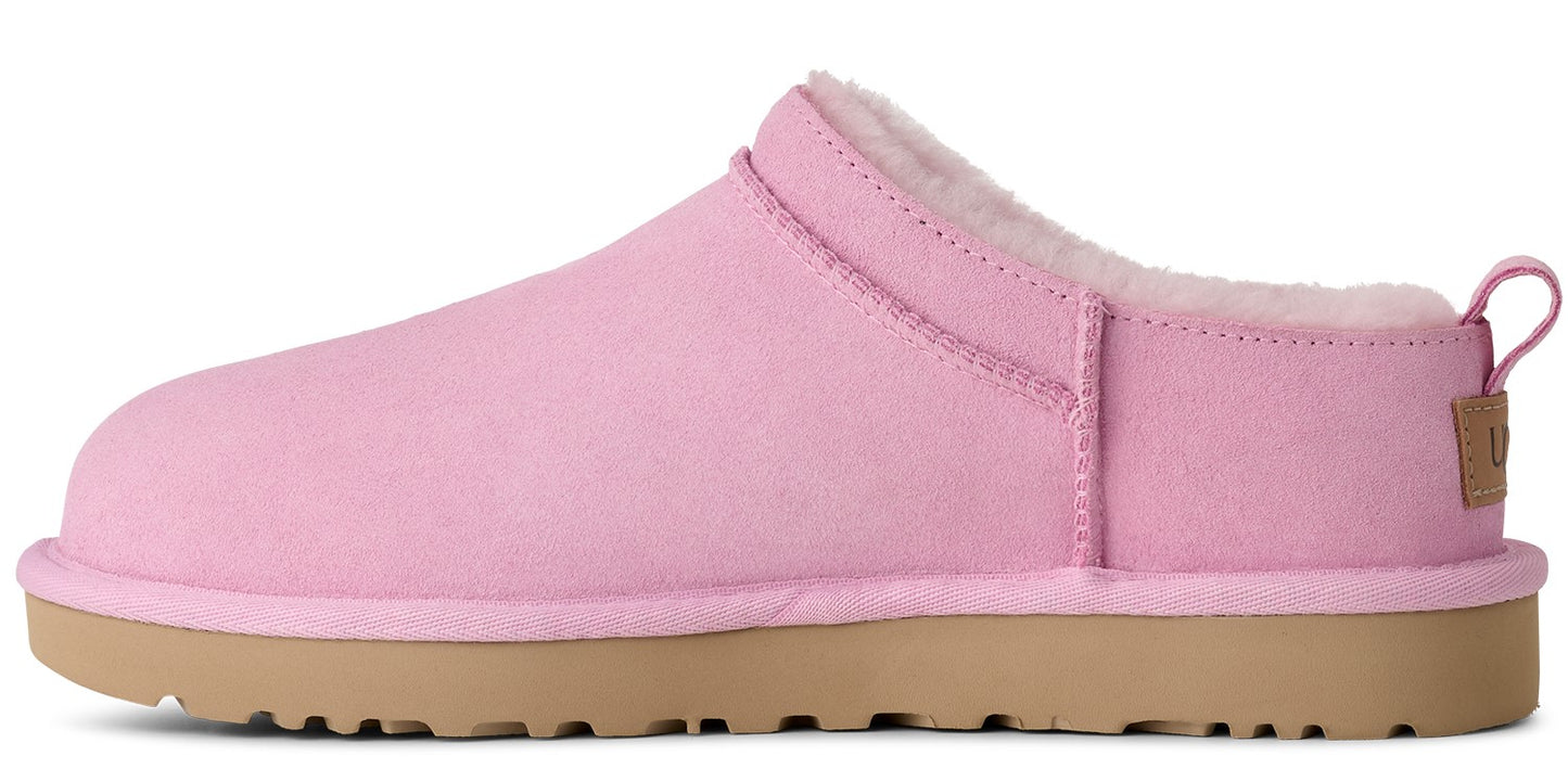 Pink slipper with tan sole and white lining.