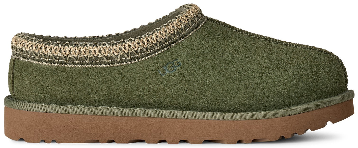 An olive green suede Tasman slipper featuring a decorative braided collar with tan embroidery and a brown rubber sole, with an embossed brand logo on the side.