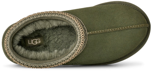 A top-down view of an olive green slipper lined with soft, matching green faux fur, featuring a decorative braided fabric trim around the collar and a visible UGG logo label on the insole.
