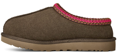 A brown slip-on shoe with pink trimming on top of the shoe.