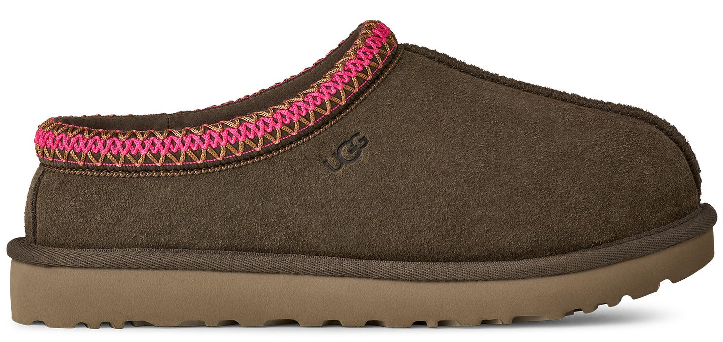 A brown UGG slipper with a pink and brown trim.