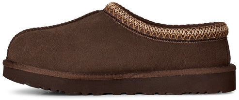 A brown suede slip-on slipper with a decorative woven trim around the collar and a thick rubber sole.