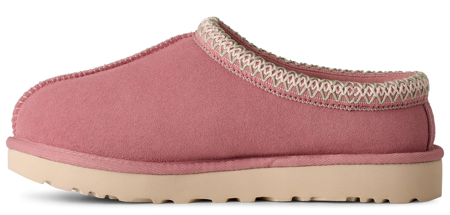Pink slipper with a beige sole and decorative trim.