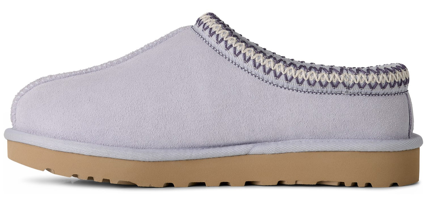 A lavender colored UGG Tasman slipper with a tan sole.
