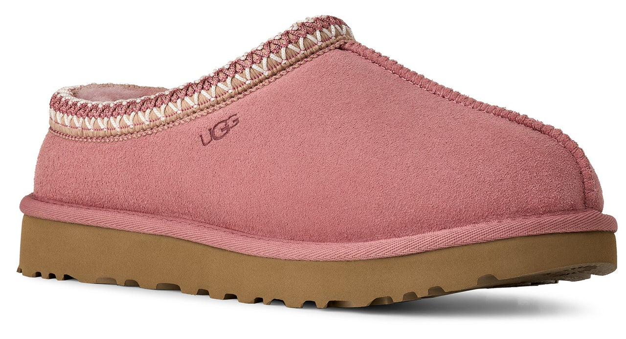 Pink suede slipper with patterned trim and tan sole.