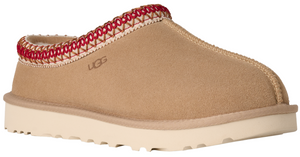 Tan slipper with red and white trim and a white sole, featuring the logo "UGG".