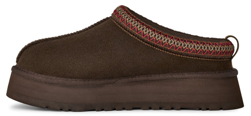 A brown slip-on shoe with a decorative band.