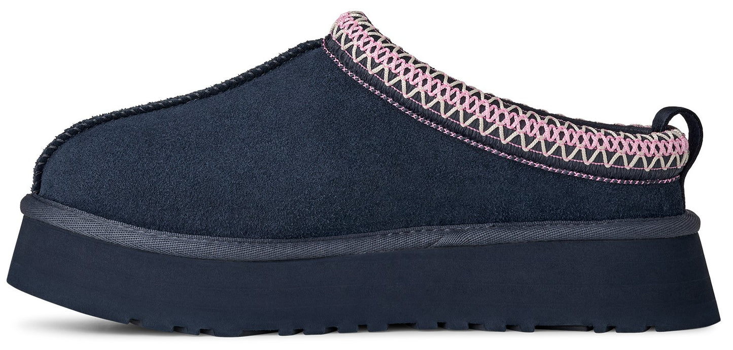 Navy blue clog style slipper with a platform sole and pink and white trim around the opening.