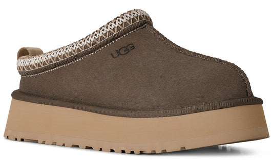 Slip-on platform shoe in brown with a beige sole and 'UGG' logo.