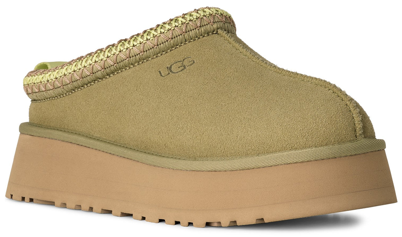 Slip-on platform shoe in light brown suede with decorative woven trim and logo.