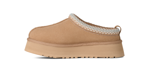 Tan slip-on platform shoe with zig-zag trim.